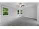 Bedroom features a tray ceiling, large windows, and neutral colors at 1158 Welch Sw St, Atlanta, GA 30310