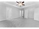 Bedroom features a tray ceiling, neutral colors, and multiple doorways and closet at 1158 Welch Sw St, Atlanta, GA 30310