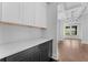 Stylish butler's pantry featuring white cabinets and dark countertops at 1158 Welch Sw St, Atlanta, GA 30310