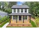 Beautiful two-story home with black framed windows and a cozy front porch at 1158 Welch Sw St, Atlanta, GA 30310
