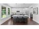 Kitchen features stainless steel appliances, hardwood floors, island and sleek countertops at 1158 Welch Sw St, Atlanta, GA 30310