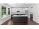 Kitchen features stainless steel appliances, hardwood floors, island and sleek countertops at 1158 Welch Sw St, Atlanta, GA 30310