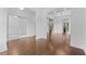 Open floor plan with rich hardwood floors, leading to a room with coffered ceilings at 1158 Welch Sw St, Atlanta, GA 30310