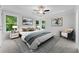 Bedroom features a tray ceiling, large windows, stylish decor, and neutral colors at 1158 Welch Sw St, Atlanta, GA 30310