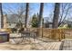 Wooden back deck with outdoor seating and a peaceful view of the surrounding yard and mature trees at 333 Drexel Ave, Decatur, GA 30030