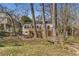 Backyard view featuring wooden decks and mature trees, set against the backdrop of neighboring homes at 333 Drexel Ave, Decatur, GA 30030