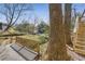 Backyard featuring a wooden deck and pathway, and a view of the surrounding trees and landscaping at 333 Drexel Ave, Decatur, GA 30030