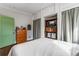 Bedroom with built-in storage and shelving, complemented by a light color scheme and a soft white comforter at 333 Drexel Ave, Decatur, GA 30030