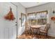 Bright breakfast nook with vintage-style table, chairs, and ample natural light from the large windows at 333 Drexel Ave, Decatur, GA 30030