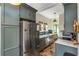 Well-organized kitchen with built-in cabinets, stainless steel refrigerator, and a cozy breakfast nook at 333 Drexel Ave, Decatur, GA 30030