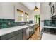 Kitchen featuring sleek cabinets, quartz countertops, copper faucet, and stainless-steel appliances at 333 Drexel Ave, Decatur, GA 30030