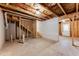 Unfinished basement with exposed wooden framing, mechanicals, and concrete floor at 992 Belfry Ter, Fairburn, GA 30213