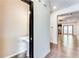 Inviting entryway with hardwood floors, a pedestal sink, and access to the living spaces at 992 Belfry Ter, Fairburn, GA 30213
