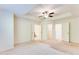 Bright bedroom with a ceiling fan, ensuite bathroom, and walk in closet at 992 Belfry Ter, Fairburn, GA 30213