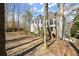 Expansive backyard features mature trees, natural landscaping and a deck perfect for outdoor enjoyment at 130 Cauley Club Ct, Johns Creek, GA 30097