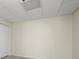 Spacious basement area with tiled ceiling and neutral walls offers potential for customized living space at 130 Cauley Club Ct, Johns Creek, GA 30097