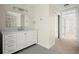 Bathroom with white vanity and a view into the hallway at 130 Cauley Club Ct, Johns Creek, GA 30097