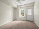 Bright bedroom with neutral walls, plush carpeting, and a ceiling fan provides a cozy atmosphere at 130 Cauley Club Ct, Johns Creek, GA 30097