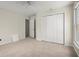 Bedroom featuring carpeted floors, neutral walls, a ceiling fan, and a closet at 130 Cauley Club Ct, Johns Creek, GA 30097