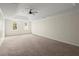 Spacious bedroom with neutral walls, recessed lighting, and large windows provides ample natural light at 130 Cauley Club Ct, Johns Creek, GA 30097