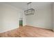 Bright dining room featuring hardwood floors and a modern light fixture at 130 Cauley Club Ct, Johns Creek, GA 30097