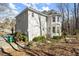 Well-maintained home featuring a turret-style architectural design with a meticulously landscaped yard at 130 Cauley Club Ct, Johns Creek, GA 30097