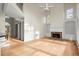Large living room with built-in shelving, fireplace, and lots of natural light at 130 Cauley Club Ct, Johns Creek, GA 30097