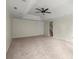 Large, carpeted living room with neutral walls and recessed lighting provides a versatile living area at 130 Cauley Club Ct, Johns Creek, GA 30097