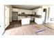 Bright kitchen featuring white cabinetry, an island, and stylish backsplash, creating a clean and inviting space at 33 Cambridge Ln, Dallas, GA 30157
