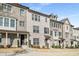 Charming townhome featuring a light brick facade, inviting porch, and neat landscaping at 4358 White Spruce Aly, Doraville, GA 30360