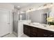 Bright bathroom with double vanity, glass shower, and contemporary fixtures at 4358 White Spruce Aly, Doraville, GA 30360