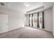 Bright bedroom with three sunlit windows and neutral carpet at 4358 White Spruce Aly, Doraville, GA 30360