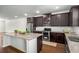 Spacious kitchen with a granite-topped island and stainless steel appliances at 4358 White Spruce Aly, Doraville, GA 30360