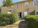 This backyard features a grill, a patio area, a white door, and green bushes at 585 Mcwilliams Se Rd # 2602, Atlanta, GA 30315