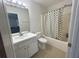This bathroom features a shower/bathtub combination with a sink and mirror at 585 Mcwilliams Se Rd # 2602, Atlanta, GA 30315