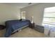 Minimalist bedroom with two windows and blue bedding at 585 Mcwilliams Se Rd # 2602, Atlanta, GA 30315