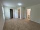 Bedroom with large closet, neutral carpet, and access to a full bathroom at 585 Mcwilliams Se Rd # 2602, Atlanta, GA 30315