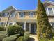 Charming home exterior featuring a covered porch, stone accents, and manicured landscaping at 585 Mcwilliams Se Rd # 2602, Atlanta, GA 30315