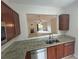 Kitchen view opening to a bright living room with a fireplace, creating an open and inviting space at 585 Mcwilliams Se Rd # 2602, Atlanta, GA 30315
