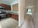 Kitchen with stainless steel appliances and an open view into a living room with lots of light at 585 Mcwilliams Se Rd # 2602, Atlanta, GA 30315