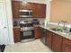 Well-lit kitchen with stainless steel appliances and granite countertops at 585 Mcwilliams Se Rd # 2602, Atlanta, GA 30315