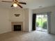 Bright living room featuring a fireplace and sliding door access to the backyard and outdoor living at 585 Mcwilliams Se Rd # 2602, Atlanta, GA 30315
