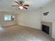 Cozy living room showcasing a fireplace and an open view to the kitchen, perfect for entertaining at 585 Mcwilliams Se Rd # 2602, Atlanta, GA 30315