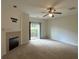 Cozy living room featuring a fireplace, carpet, and sliding glass doors leading to the outdoors at 585 Mcwilliams Se Rd # 2602, Atlanta, GA 30315