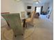 Open-concept living room features a glass table, fireplace and access to the dining room and sitting area at 585 Mcwilliams Se Rd # 2602, Atlanta, GA 30315