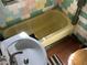 A bathroom features a bathtub, sink, and colorful tiling at 8090 Colquitt St, Douglasville, GA 30134