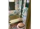 A bathroom features a bathtub, toilet, and colorful tiling at 8090 Colquitt St, Douglasville, GA 30134