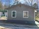 Exterior home with a concrete walkway at 8090 Colquitt St, Douglasville, GA 30134