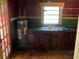 Kitchen with sink and dark cabinets and countertops at 8090 Colquitt St, Douglasville, GA 30134