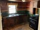 Kitchen with dark cabinets and countertops at 8090 Colquitt St, Douglasville, GA 30134